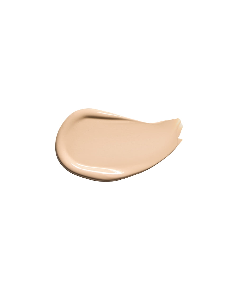 Swatch of smooth, creamy beige makeup product showcasing the texture and shade of Revitalize Hydra Concealer in a natural finish.
