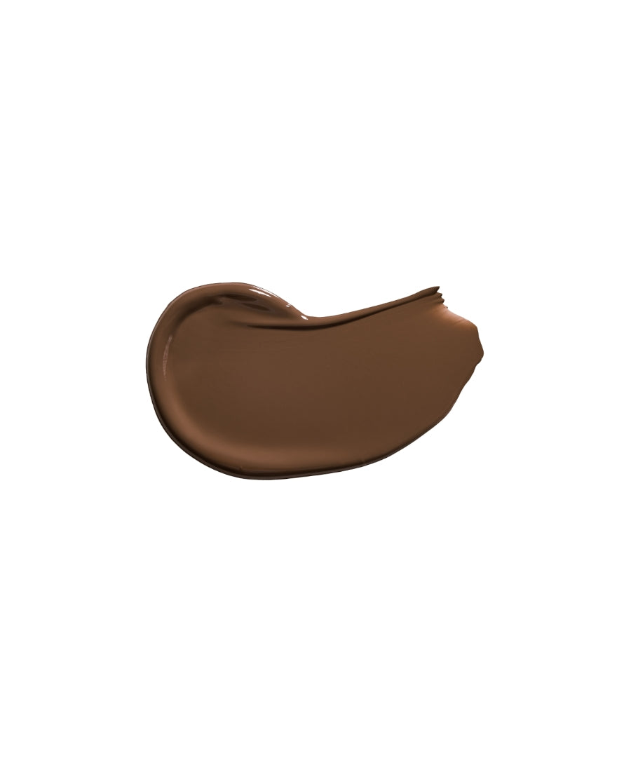 Smooth swatch of deep brown Revitalize Hydra Concealer showcasing creamy texture and rich pigmentation, ideal for natural coverage in clean beauty makeup.