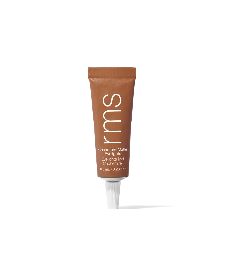 Tube of RMS Beauty Cashmere Matte Eyelights in a muted, warm brown shade with clean, minimalist packaging highlighting sustainable and clean beauty principles.
