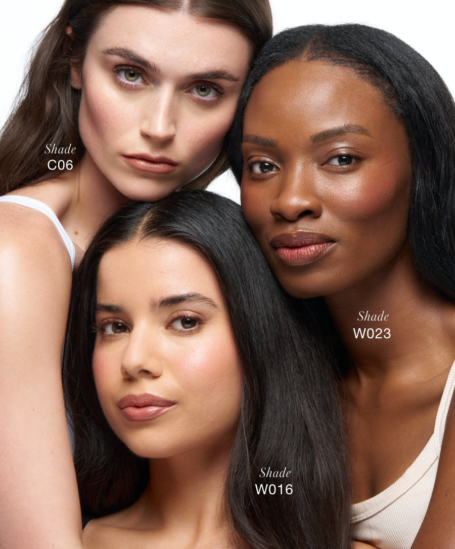 Three diverse women with flawless skin showcasing different shades of Revitalize Hydra Concealer, highlighting its natural finish and clean beauty appeal.