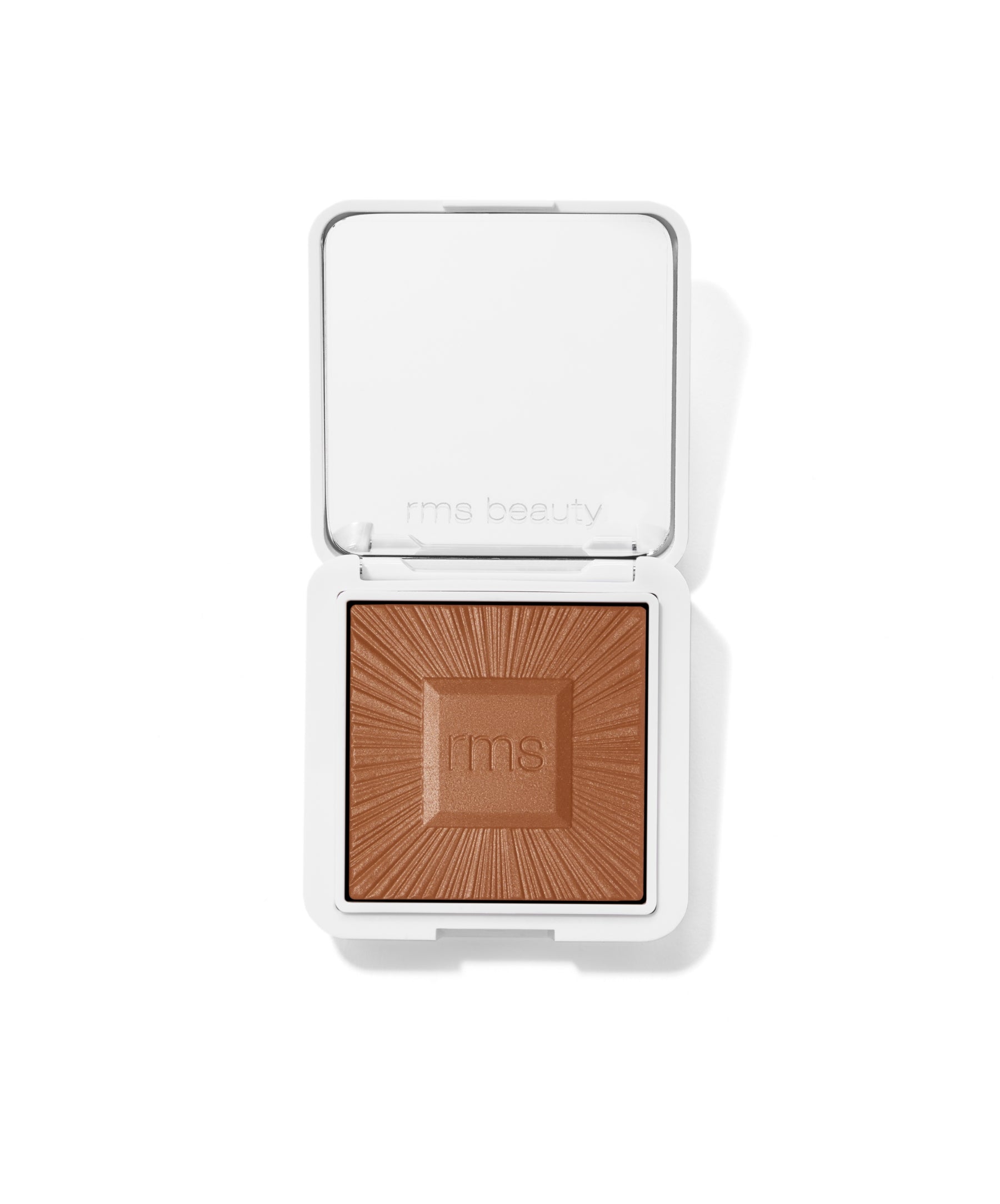Open compact of ReDimension Hydra Bronzer with a warm medium brown shade and embossed rms logo, showcasing clean beauty makeup in sleek white recyclable packaging.