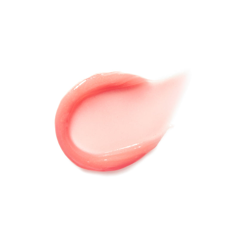 A glossy swatch of Liplights Cream Lip Gloss in a sheer, natural pink shade highlighting its smooth, creamy texture and radiant finish.