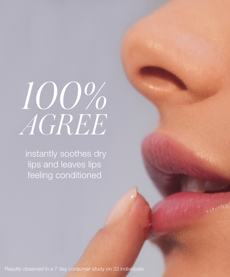 Close-up of a woman gently applying Liplights Cream Lip Gloss to her lips, showcasing its soothing and conditioning effects on dry lips with clean beauty and natural ingredients.