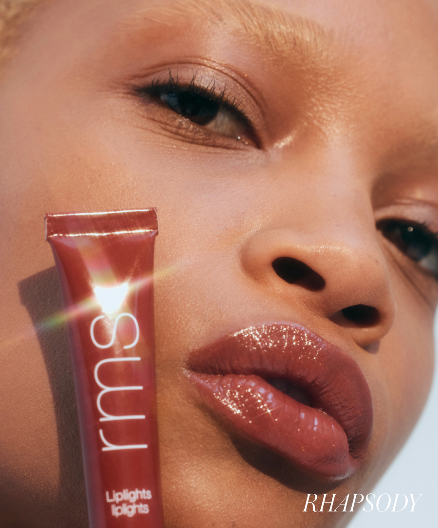 Close-up of a woman with glowing skin and glossy lips wearing Liplights Cream Lip Gloss in a rich, warm shade, highlighting natural ingredients and clean beauty.