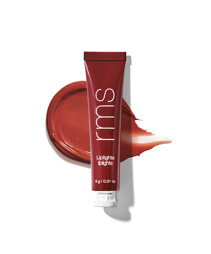 Tube of Liplights Cream Lip Gloss in a rich, warm terracotta shade with a smooth swatch of the product on a white background, highlighting its creamy texture and clean beauty appeal.