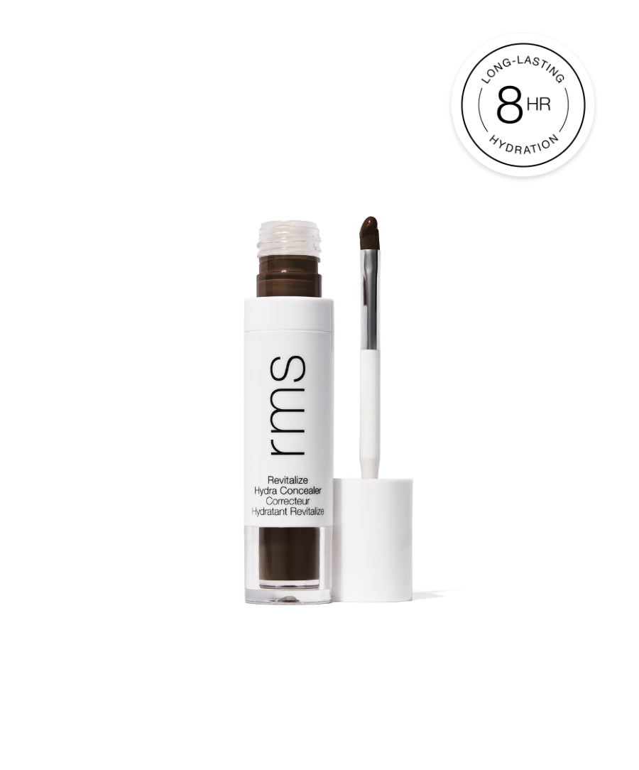 Revitalize Hydra Concealer in a sleek clear and white tube with an applicator brush, showcasing a rich dark shade and promoting 8-hour long-lasting hydration.