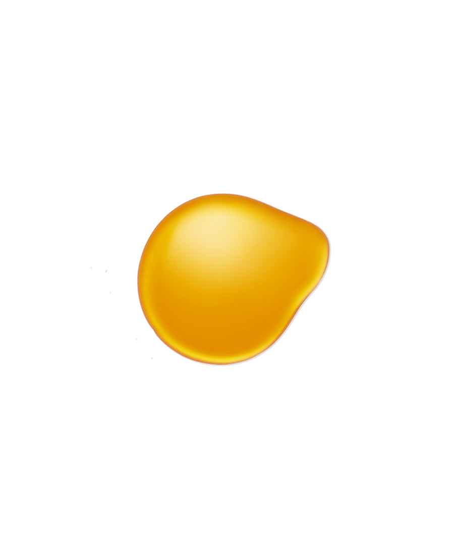 Close-up of a golden yellow oil droplet on a white background representing clean beauty and natural ingredients in Kakadu Body Oil.