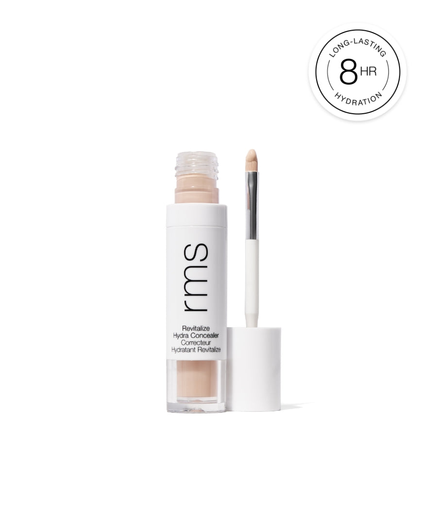 Revitalize Hydra Concealer in a clear white tube with applicator, promoting long-lasting hydration for up to 8 hours, featuring clean beauty and natural ingredients.