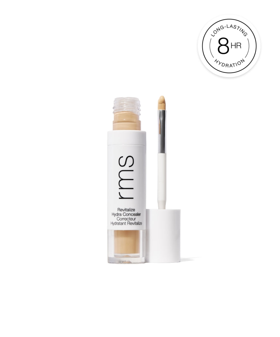 Open bottle of Revitalize Hydra Concealer with applicator showing creamy beige concealer, promoting long-lasting hydration up to 8 hours.