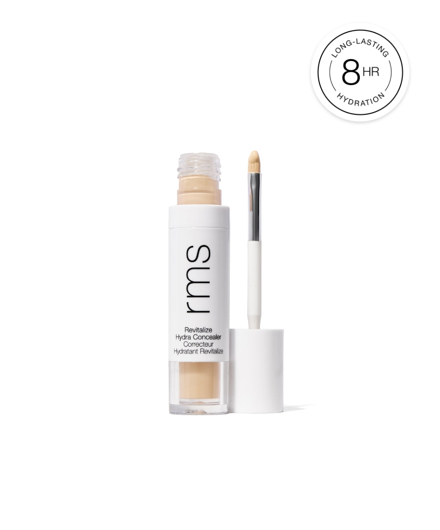 Open RMS Beauty Revitalize Hydra Concealer with applicator wand showing natural beige cream formula, promoting long-lasting hydration for up to 8 hours.