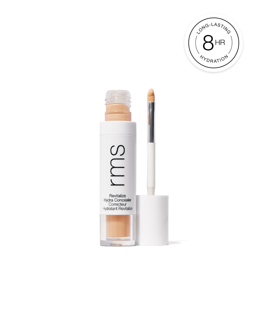 Open tube of Revitalize Hydra Concealer with applicator wand showing natural beige shade, promoting long-lasting hydration for up to 8 hours.