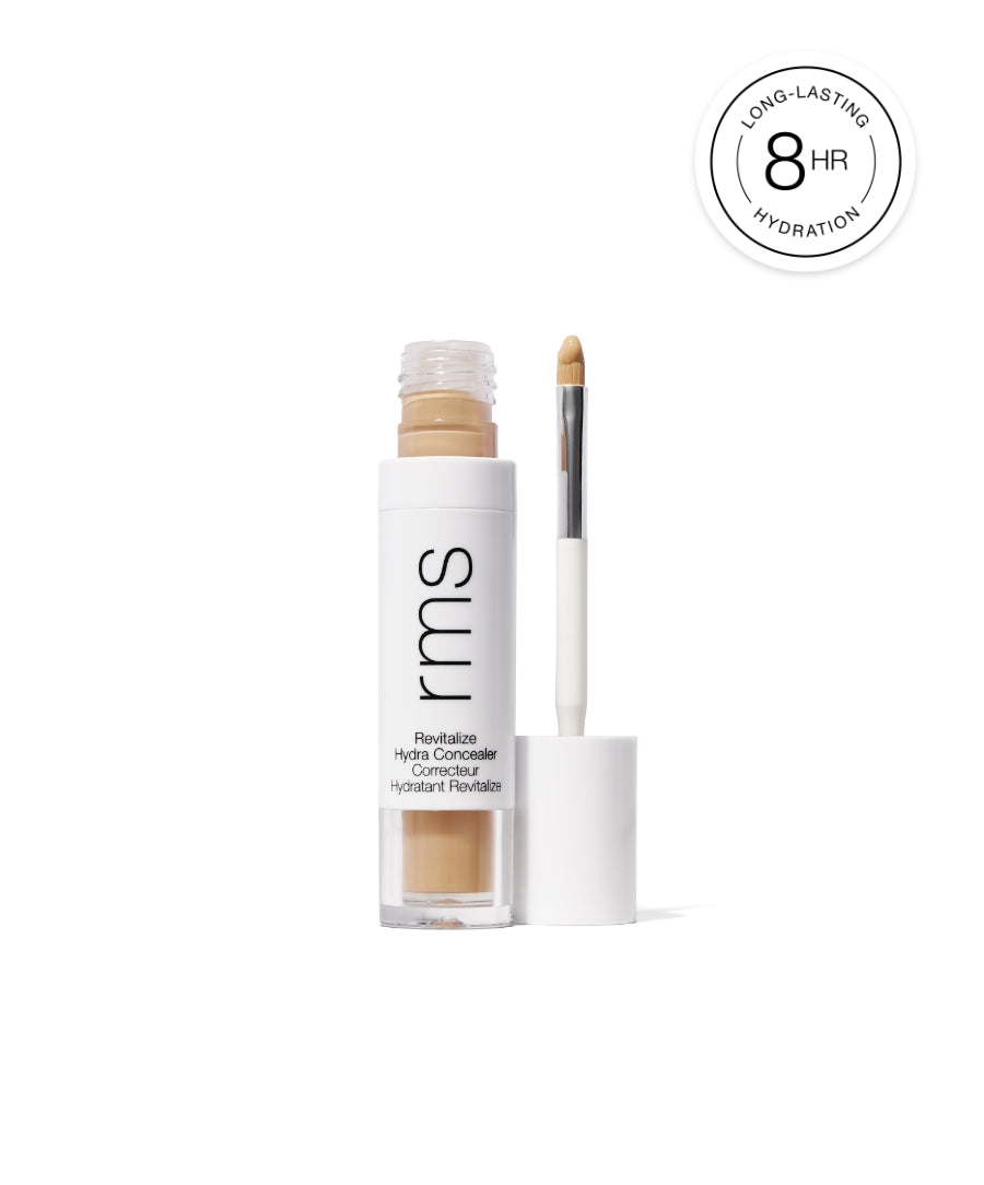 Open container of Revitalize Hydra Concealer by RMS Beauty with applicator wand showing concealer shade and a badge indicating 8-hour long-lasting hydration.