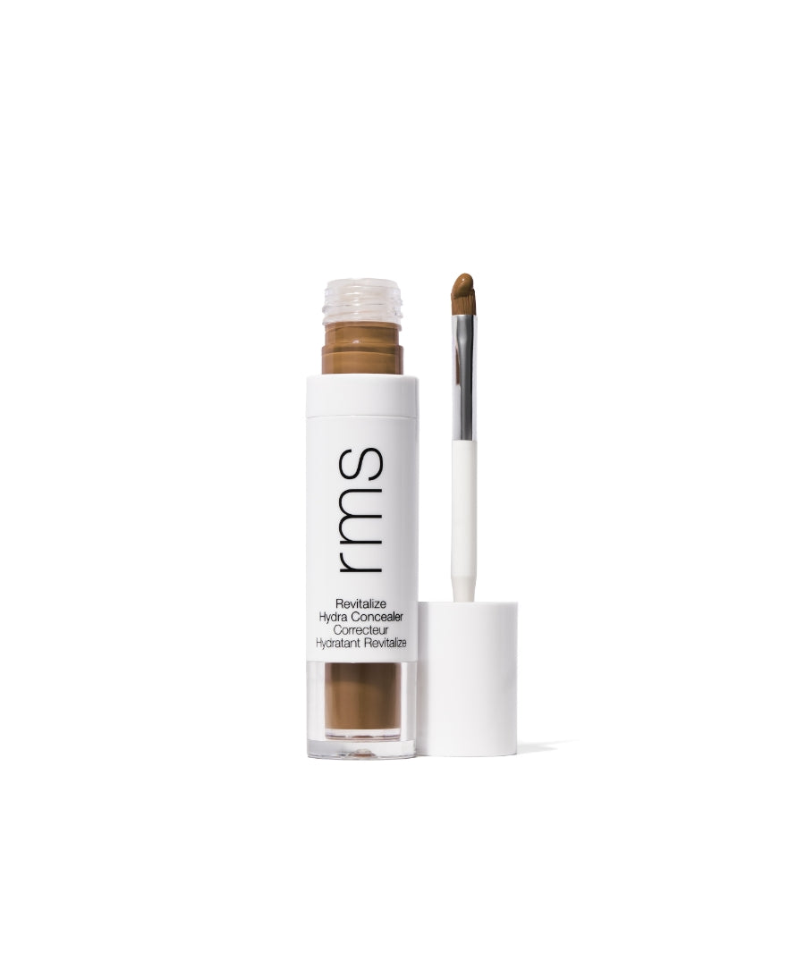 Open container of Revitalize Hydra Concealer with applicator wand featuring creamy brown concealer, designed for clean beauty and skincare infused makeup.