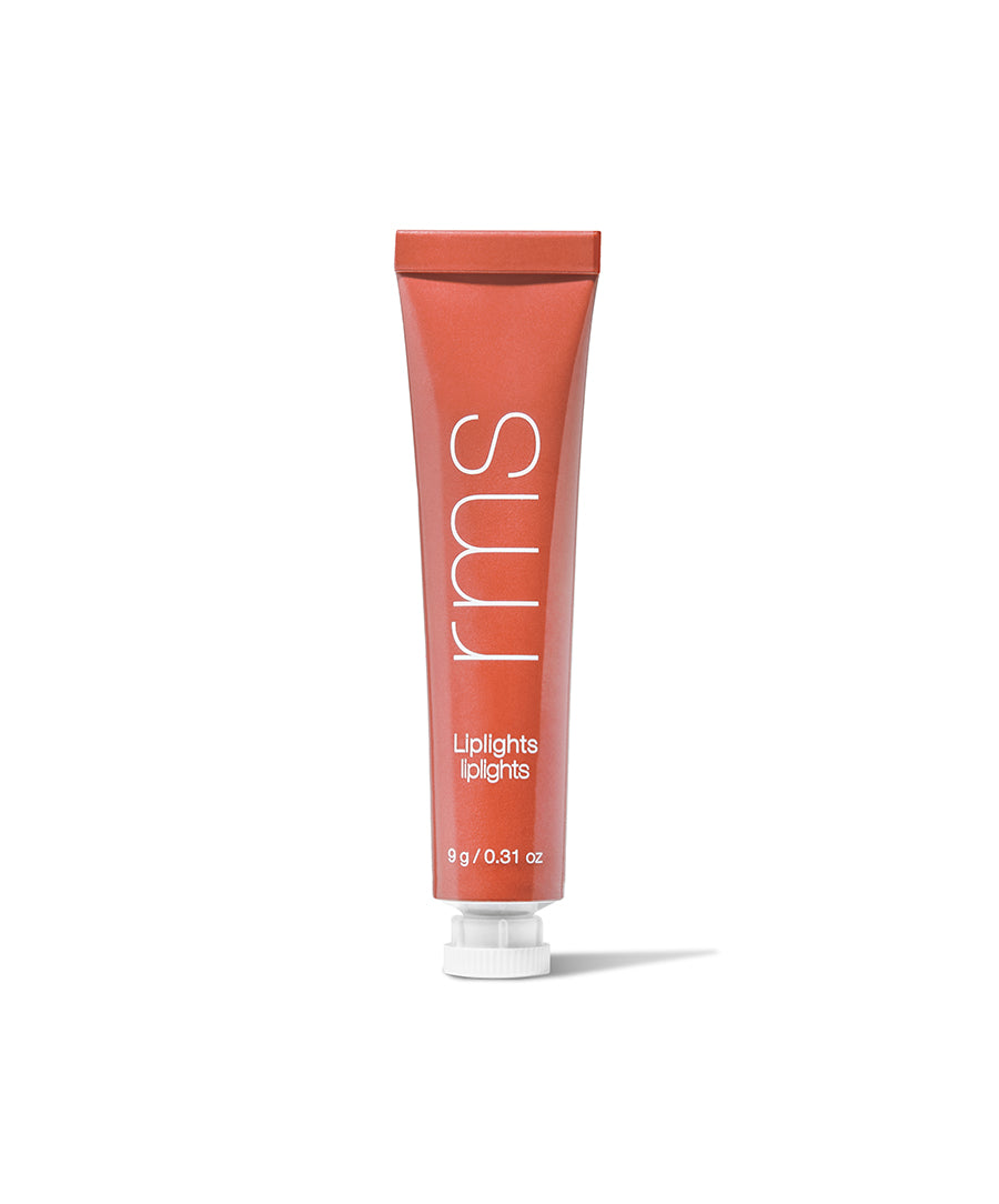Tube of Liplights Cream Lip Gloss in a warm reddish coral shade with white text on the packaging, standing upright on a white background.