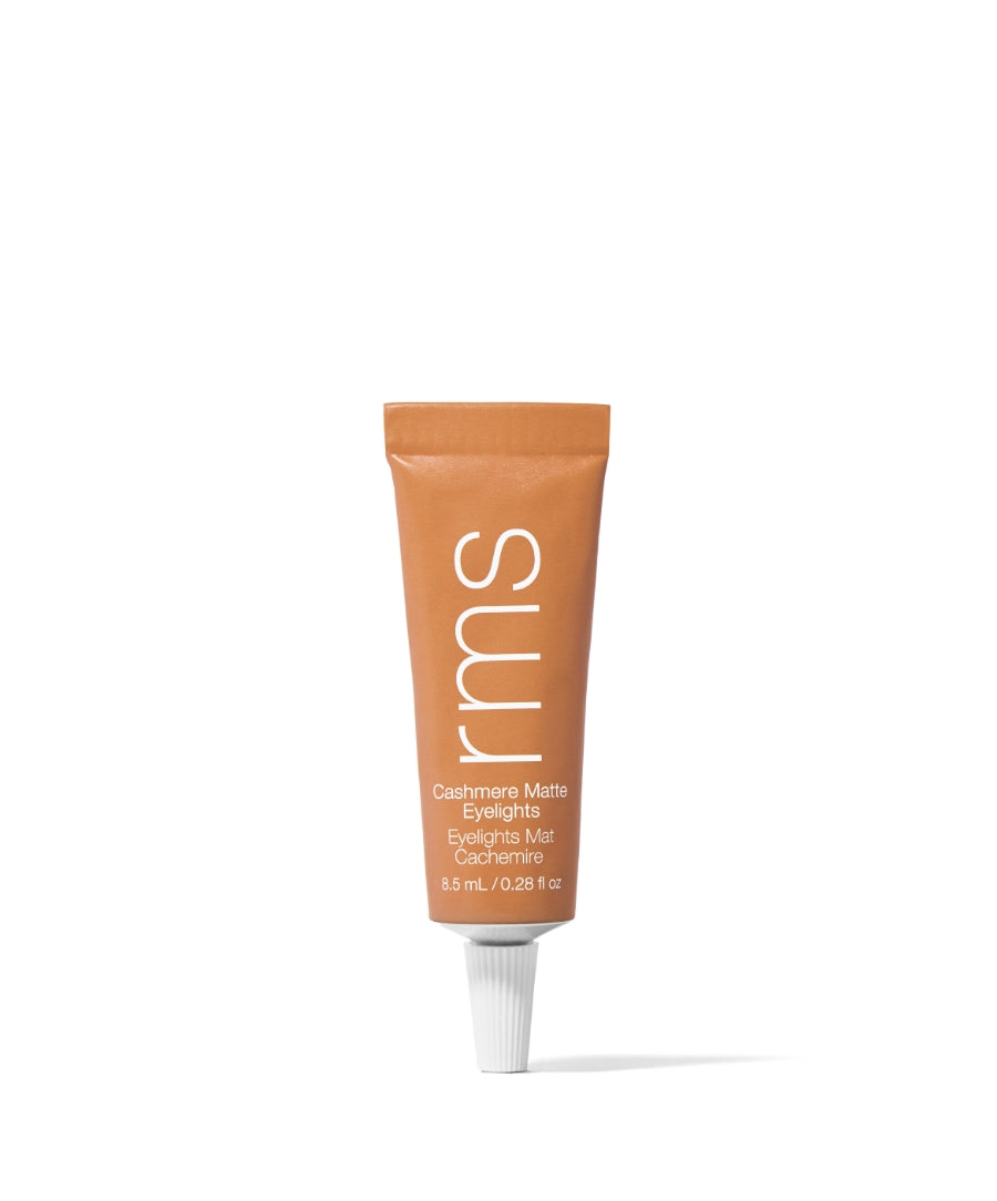 Tube of RMS Beauty Cashmere Matte Eyelights in a warm dusty trail shade, featuring clean beauty, natural ingredients, and cruelty-free makeup in sustainable packaging.