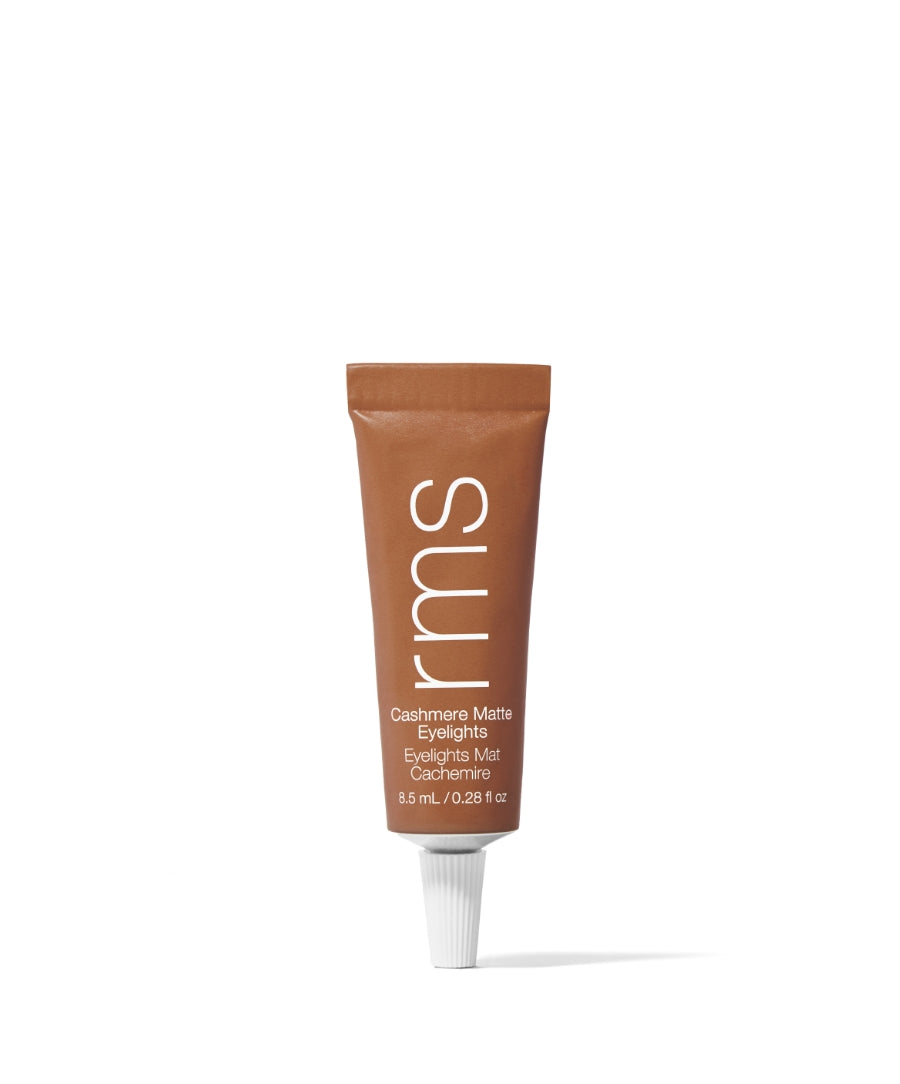 Tube of Cashmere Matte Eyelights eyeshadow in a warm, natural brown shade by RMS Beauty, featuring clean beauty ingredients and cruelty-free makeup in sustainable packaging.
