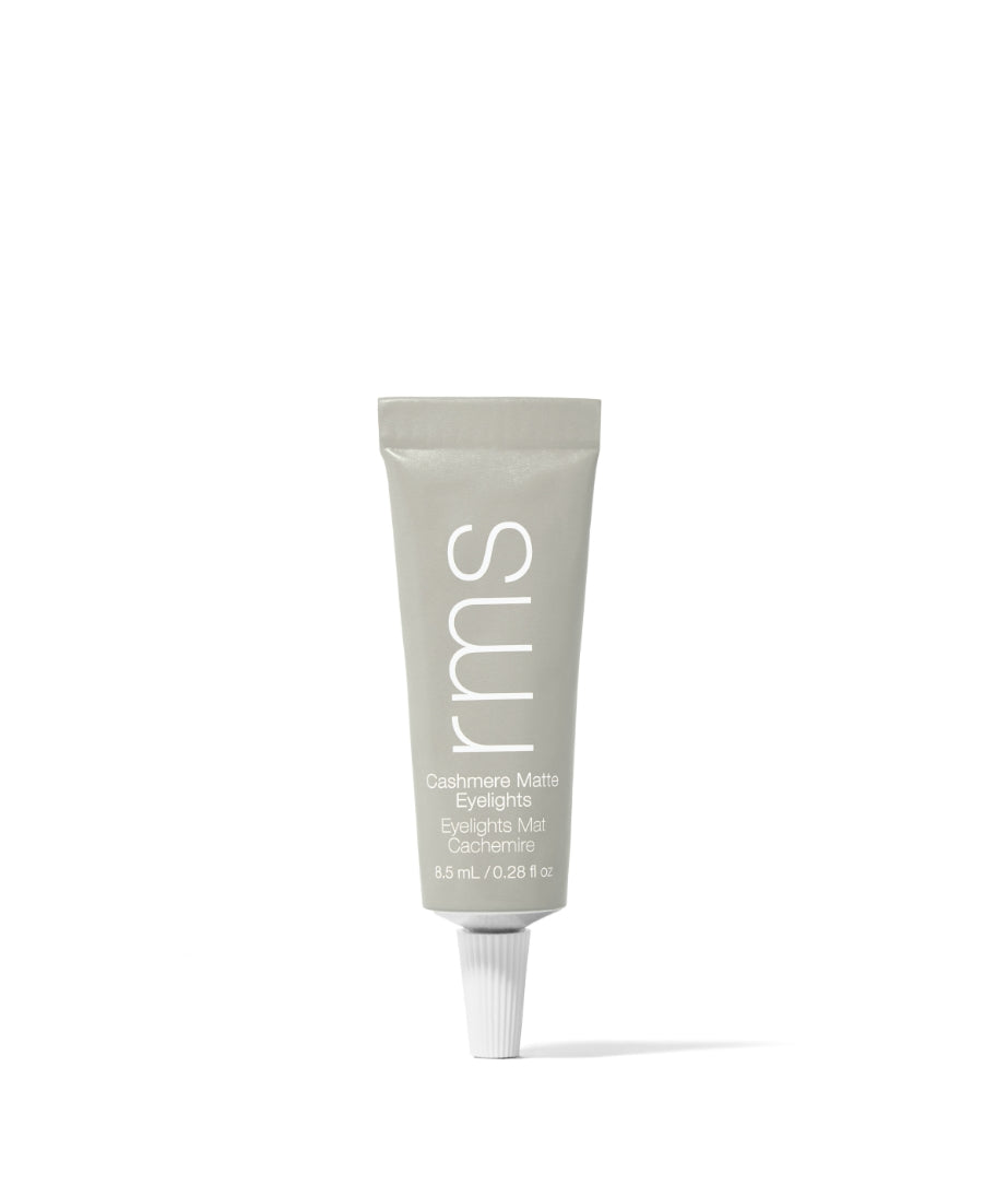 Tube of Cashmere Matte Eyelights makeup in a soft neutral shade by RMS Beauty, featuring clean, cruelty-free, and skincare-infused ingredients in sustainable packaging.
