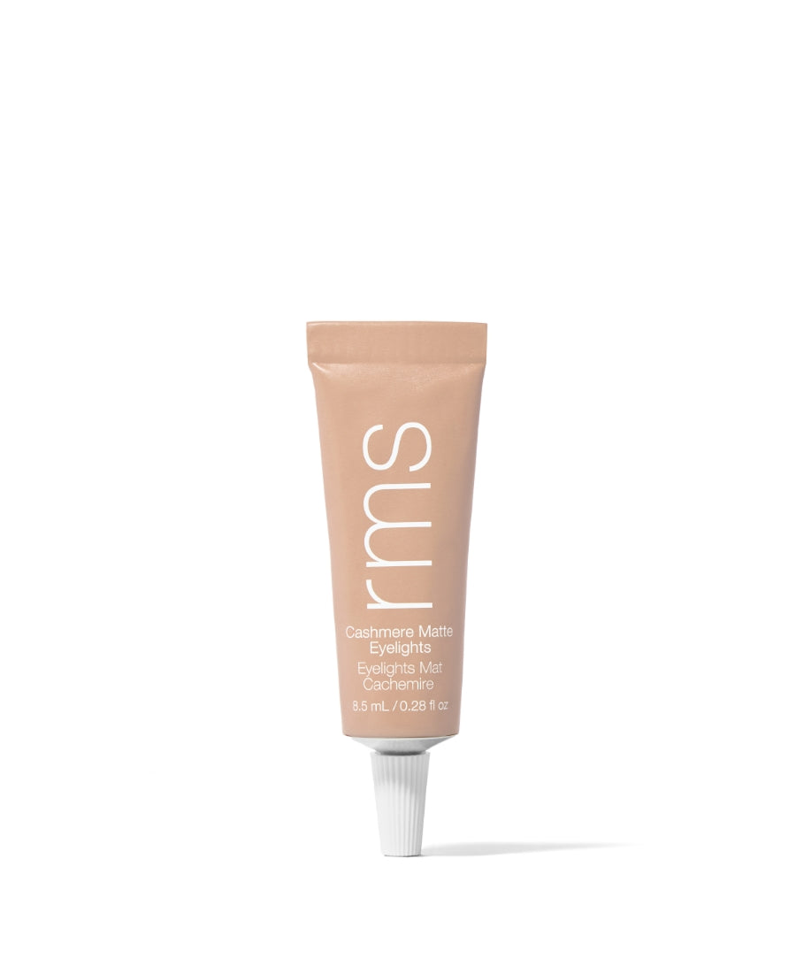 Tube of Cashmere Matte Eyelights in a soft taupe shade by RMS Beauty, featuring clean beauty, natural ingredients, and sustainable packaging for a smooth, matte finish.