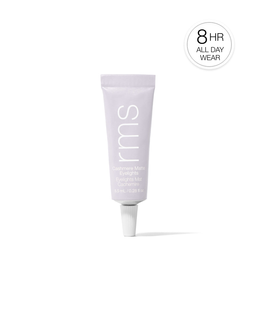 Tube of Cashmere Matte Eyelights makeup by RMS Beauty in soft muted tone, highlighting 8-hour all-day wear with clean beauty and natural ingredients.