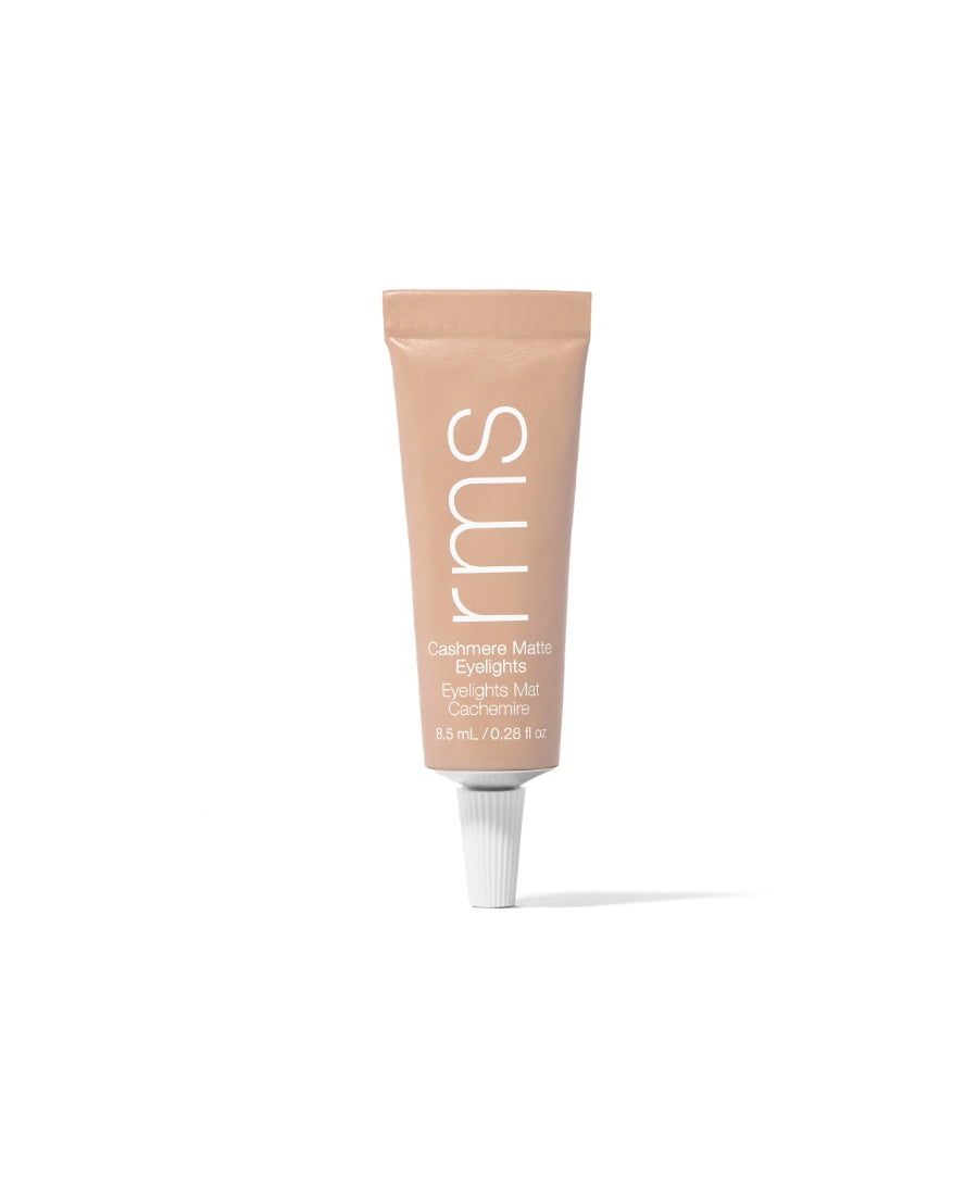 Tube of Cashmere Matte Eyelights makeup in a muted taupe shade with a minimalist design, highlighting clean beauty and natural ingredients.