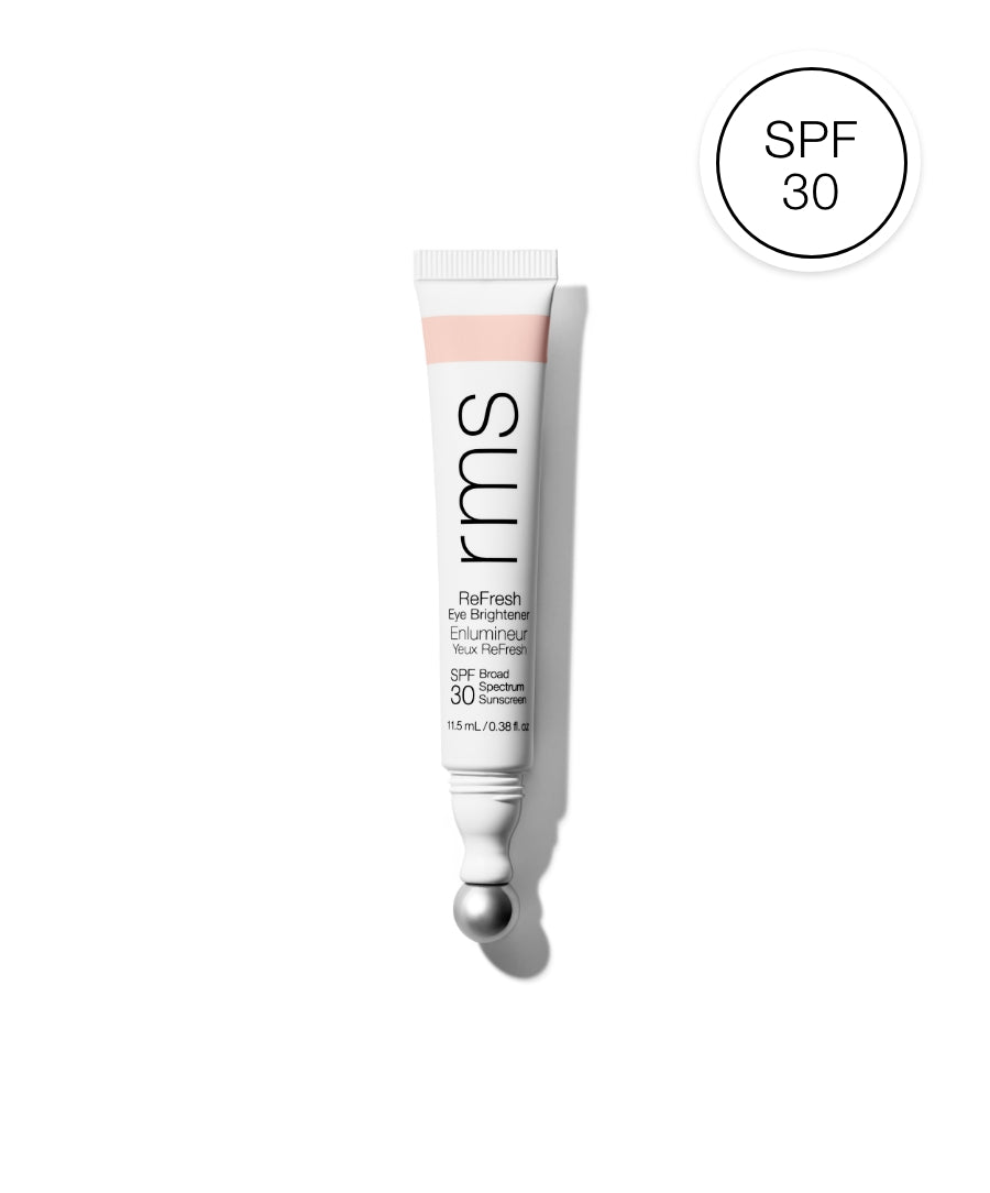 Tube of ReFresh Eye Brightener Broad Spectrum SPF 30 + Correcting Tint by RMS Beauty with a metal applicator tip and SPF 30 badge on white background.