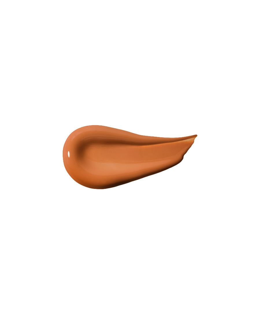 Smooth swatch of warm, medium tan ReFresh Eye Brightener Broad Spectrum SPF 30 + Correcting Tint showcasing its creamy texture and natural finish for clean beauty makeup.