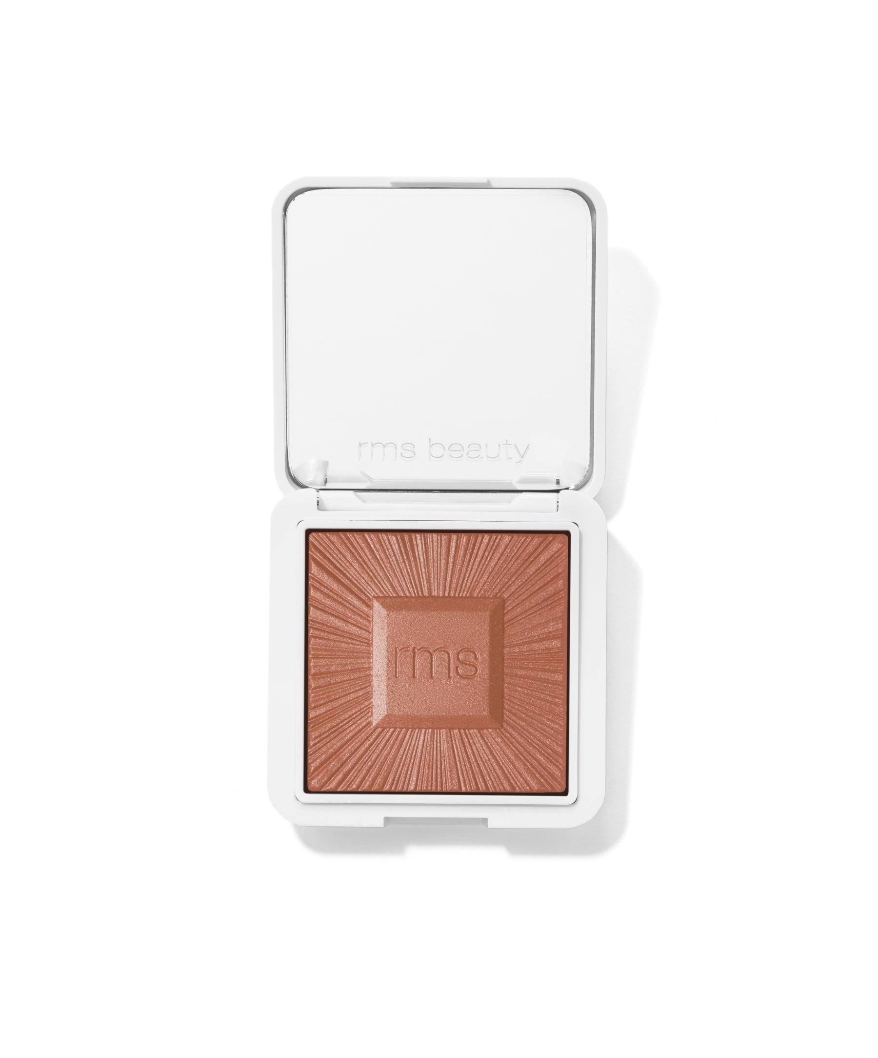 ReDimension Hydra Bronzer in a clean white compact, featuring warm bronze powder with embossed rays and rms beauty logo, cruelty free makeup with natural ingredients