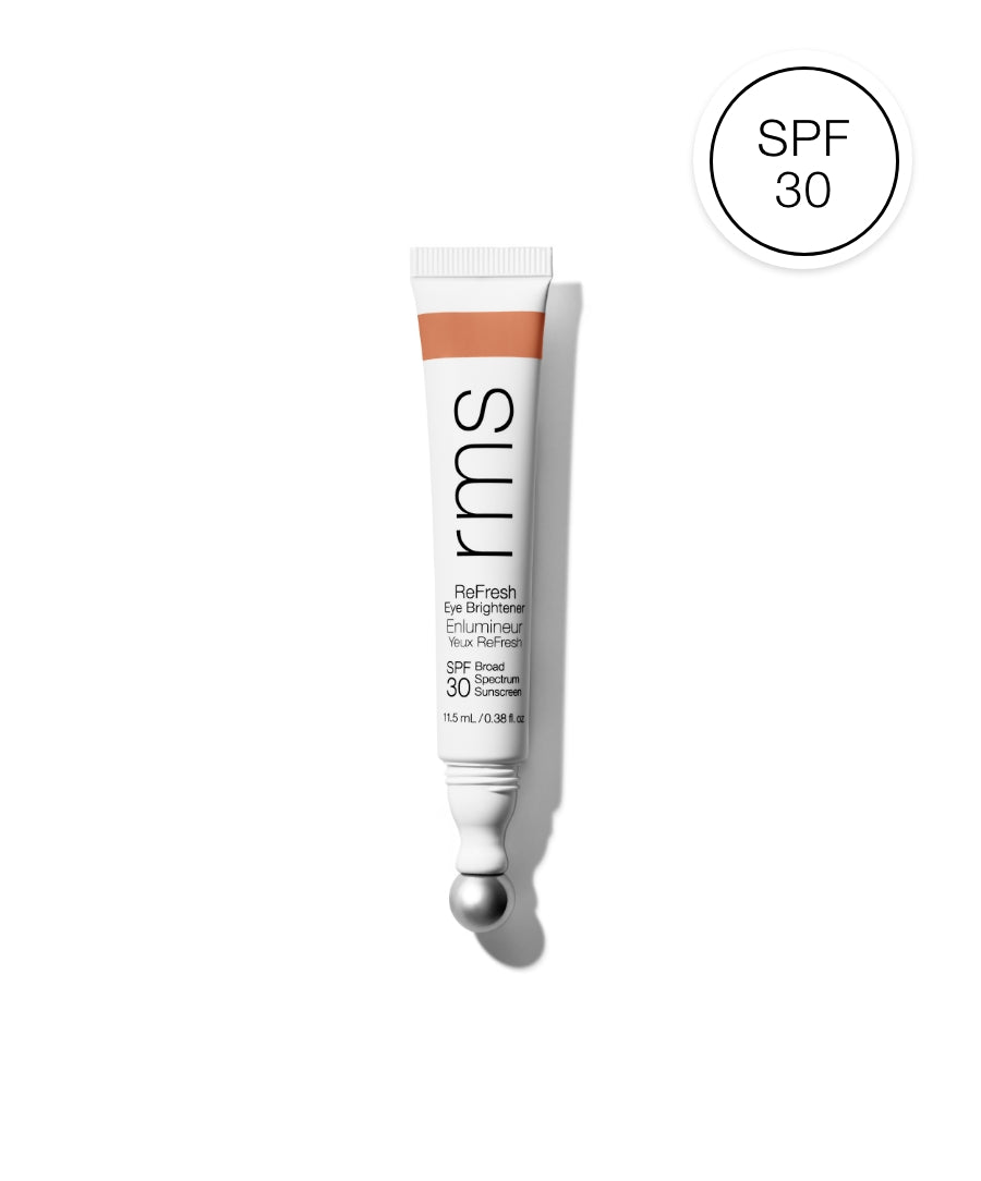 Tube of ReFresh Eye Brightener Broad Spectrum SPF 30 + Correcting Tint by RMS Beauty with a metallic applicator tip and SPF 30 badge, highlighting clean beauty and skincare infused makeup.