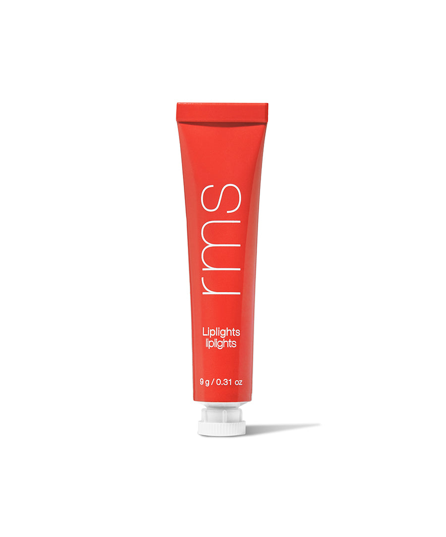 Red tube of RMS Beauty Liplights Cream Lip Gloss standing upright with white text on the front, featuring a minimalistic design and clean beauty appeal.