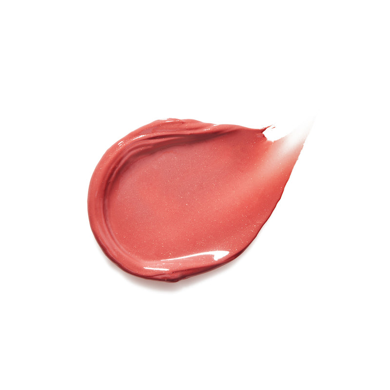 Smooth swatch of Liplights Cream Lip Gloss in a soft, natural coral shade featuring clean beauty and skincare infused makeup benefits.