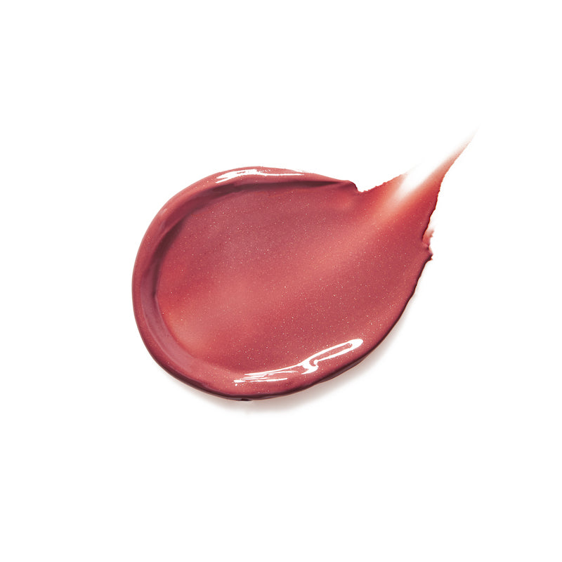 Close-up of a smooth and glossy rose-toned swatch of Liplights Cream Lip Gloss showcasing its creamy texture and radiant finish.
