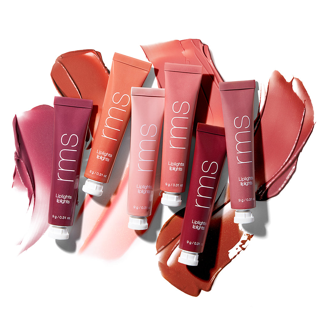 Six tubes of Liplights Cream Lip Gloss in various shades arranged on a white background with matching creamy swatches behind each tube, highlighting smooth, natural colors.