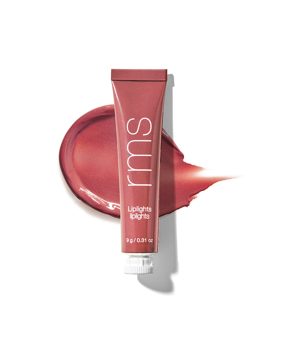 Tube of Liplights Cream Lip Gloss in a muted rose shade with a smooth, glossy texture swatched on a white background.